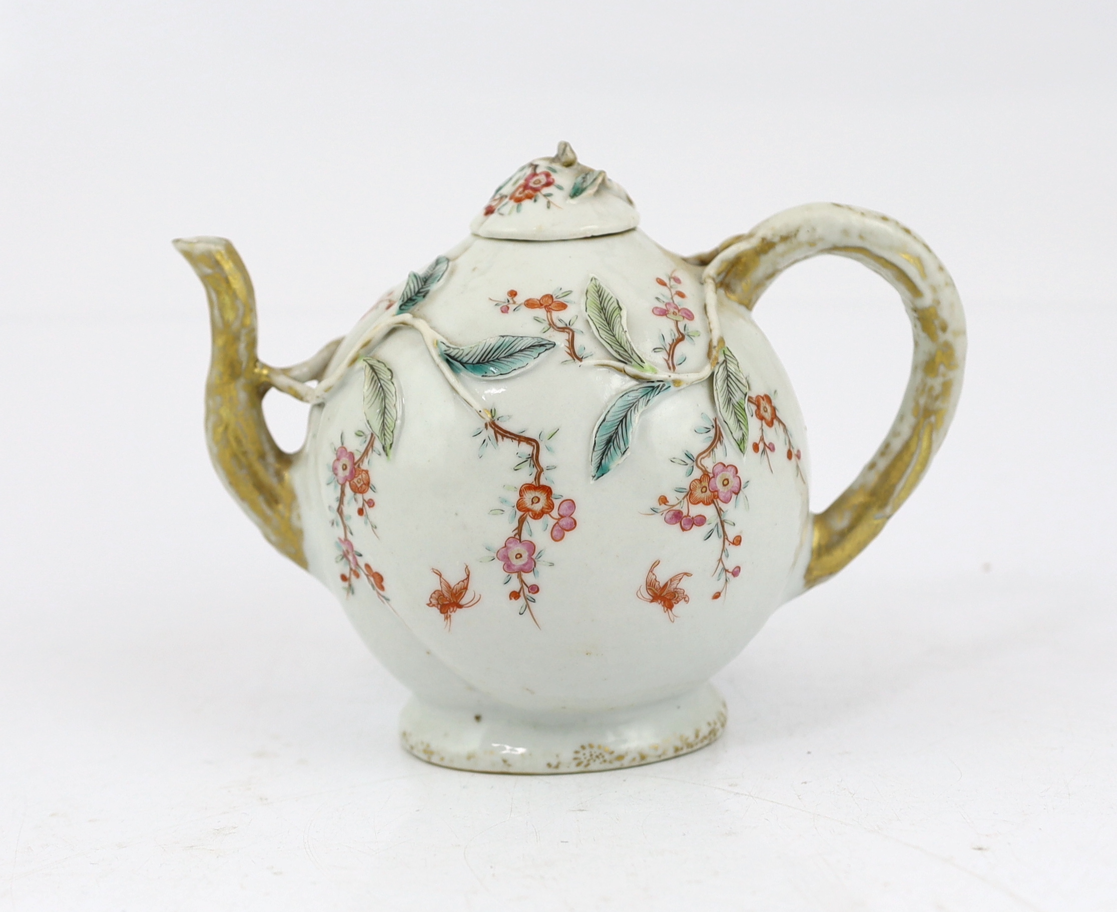 A Chinese enamelled porcelain peach-shaped teapot, Qianlong period (1736-95), wear to gilding